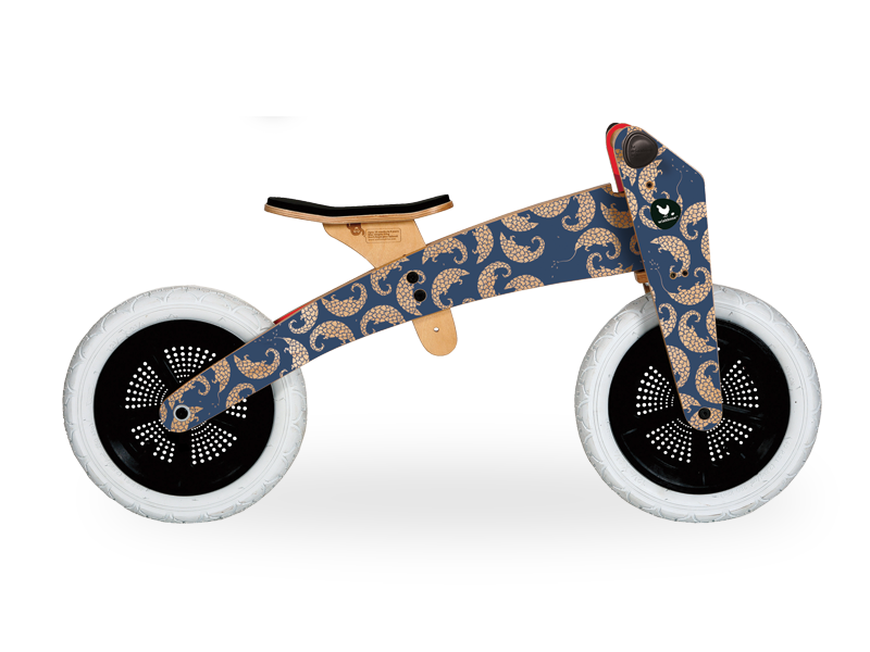 Wooden running bike in high mode, blue with pangolin artwork