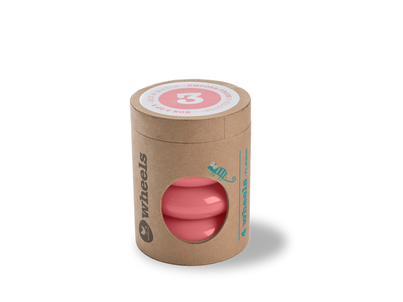 pink wheels in cardboard tube