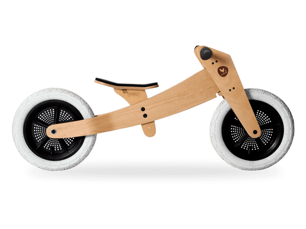 Wooden running bike in low mode