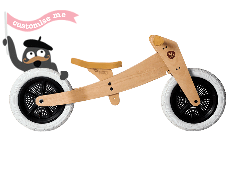 Wooden running bike with changing colours of seatcovers and grips